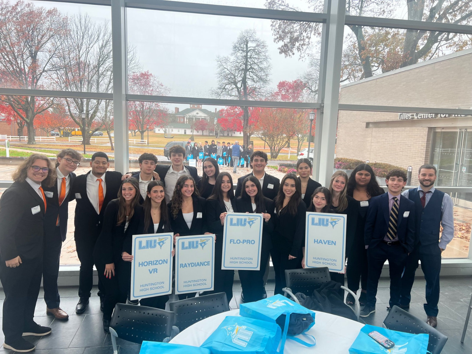 The Huntington Virtual Enterprise business executives with teacher Bryan Outsen.