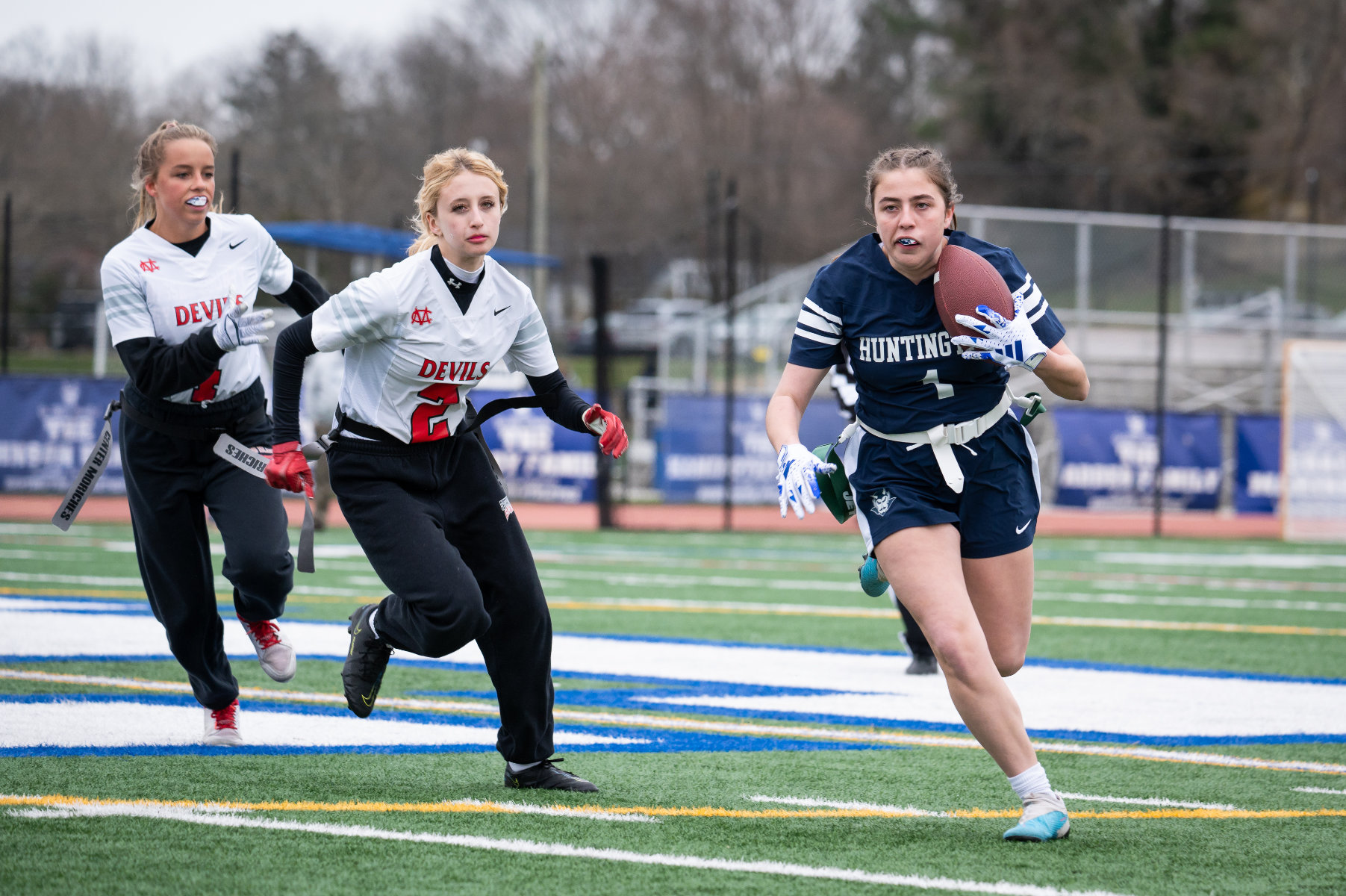 Kaylee Smalling carries the football for the Blue Devils. (Darin Reed photo.)