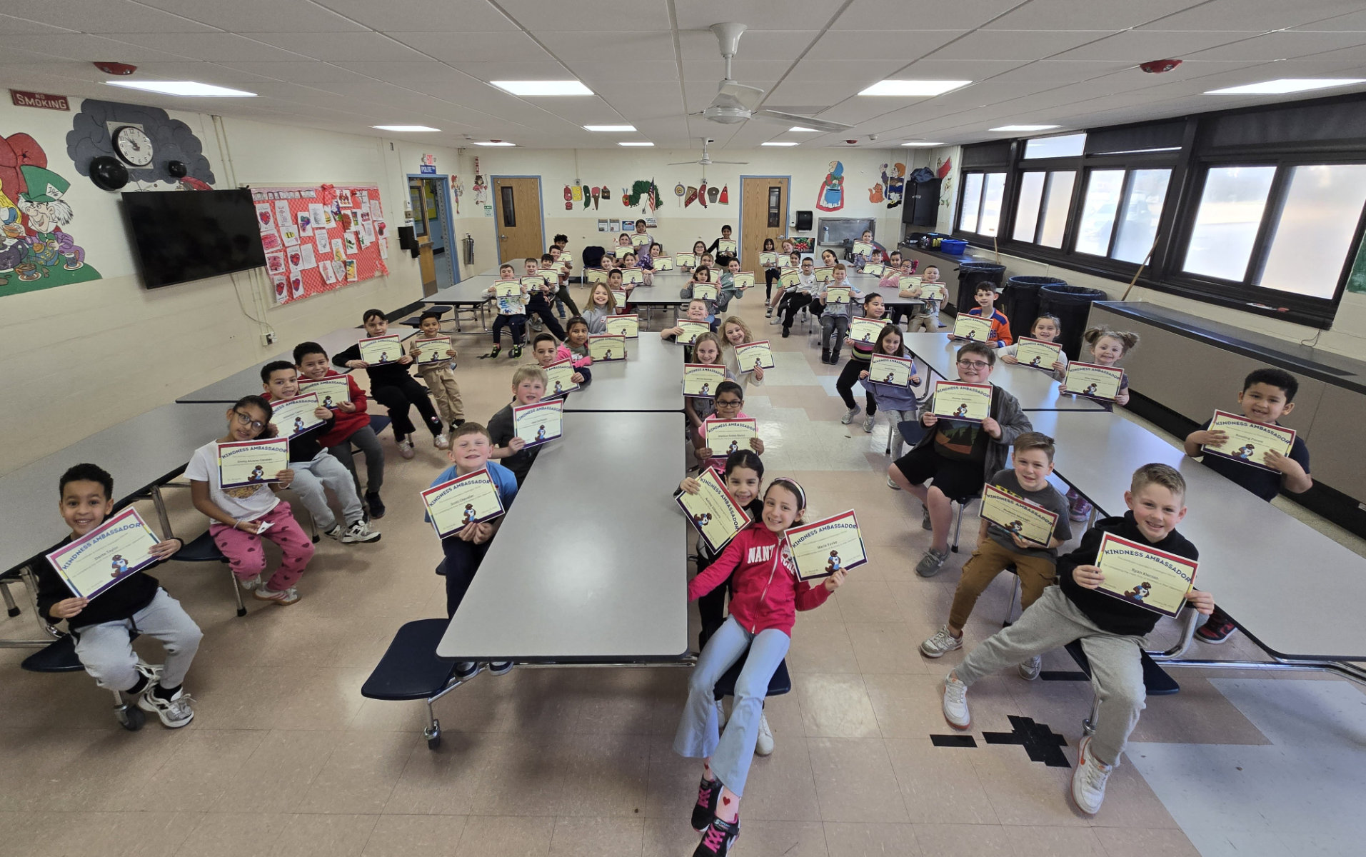  Washington's Kindness Ambassadors gathered in the cafeteria for a group photos.  