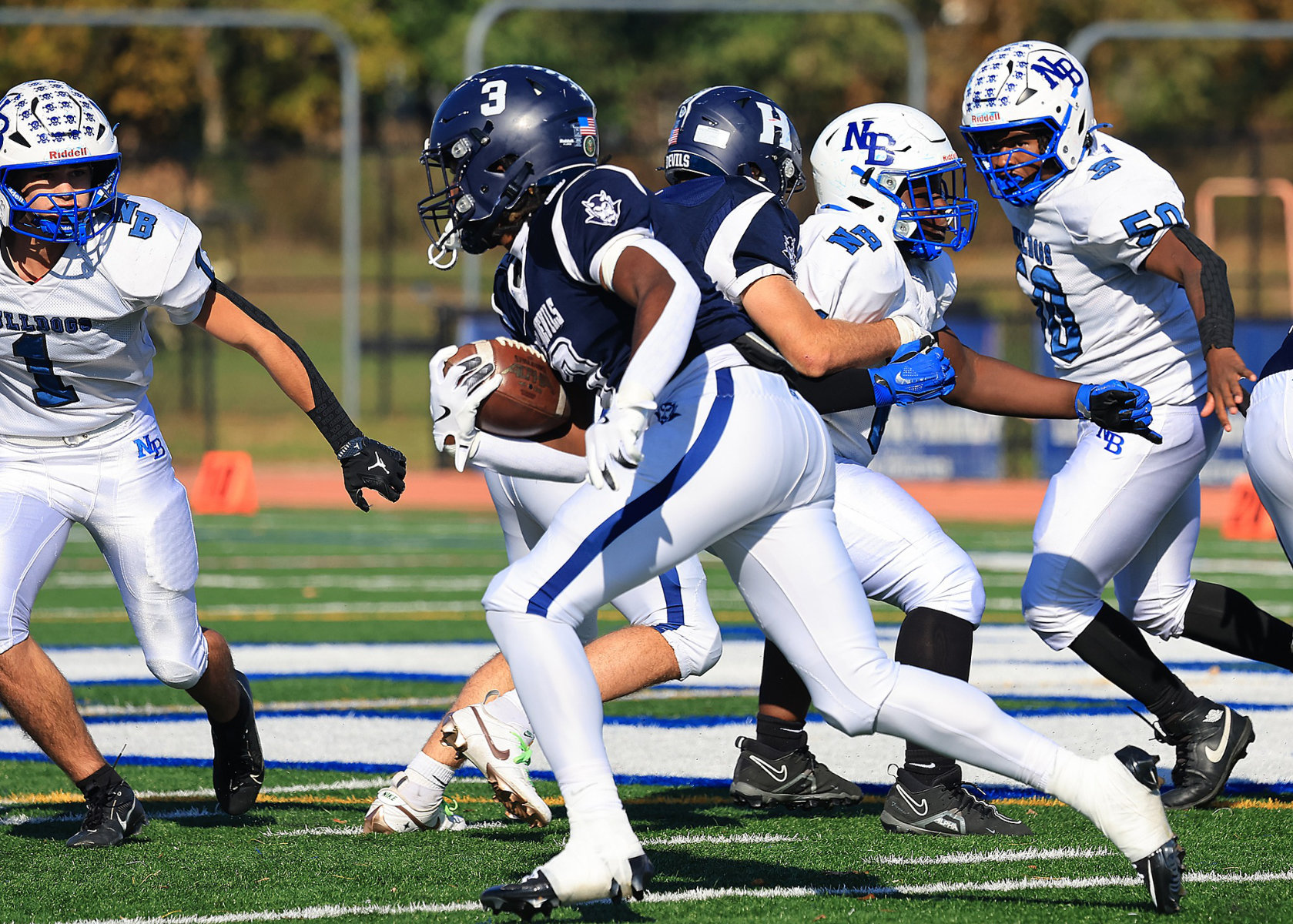  Yasir Jones cuts through the line en route to one of his three touchdowns. (Ray Nelson photo.  