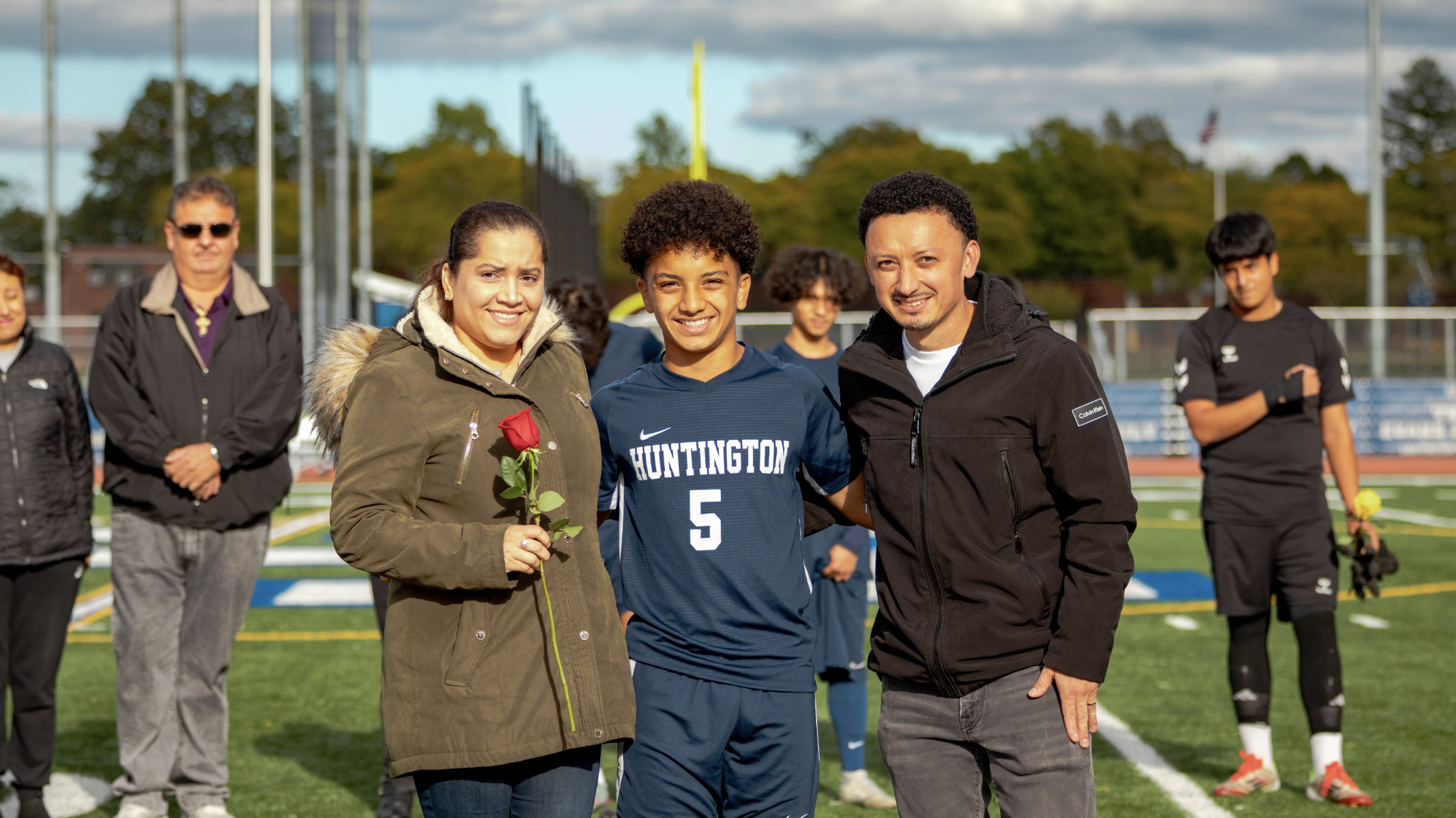  Midfield Xavier Garcia and his parents on Huntington boys' soccer Senior Day. (Edgar Vidal photo.)  