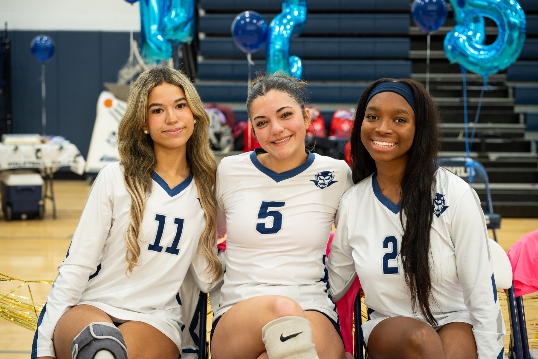  Huntington volleyball seniors Mia Miller, Emily Barba and Kymora Dorvilus. (Darin Reed photo.) 