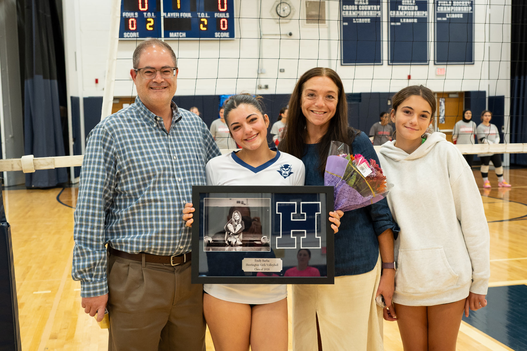 Emily Barba and her family on Senior Day for the Blue Devil girls' volleyball team. (Darin Reed photo.)