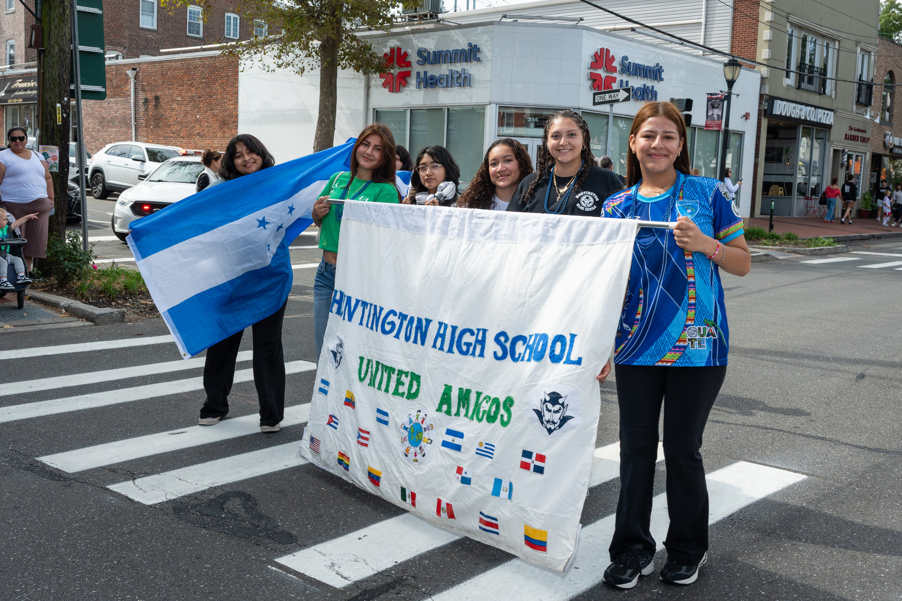  United Amigos club members in the Homecoming Day parade last Saturday. (Darin Reed photo.)  