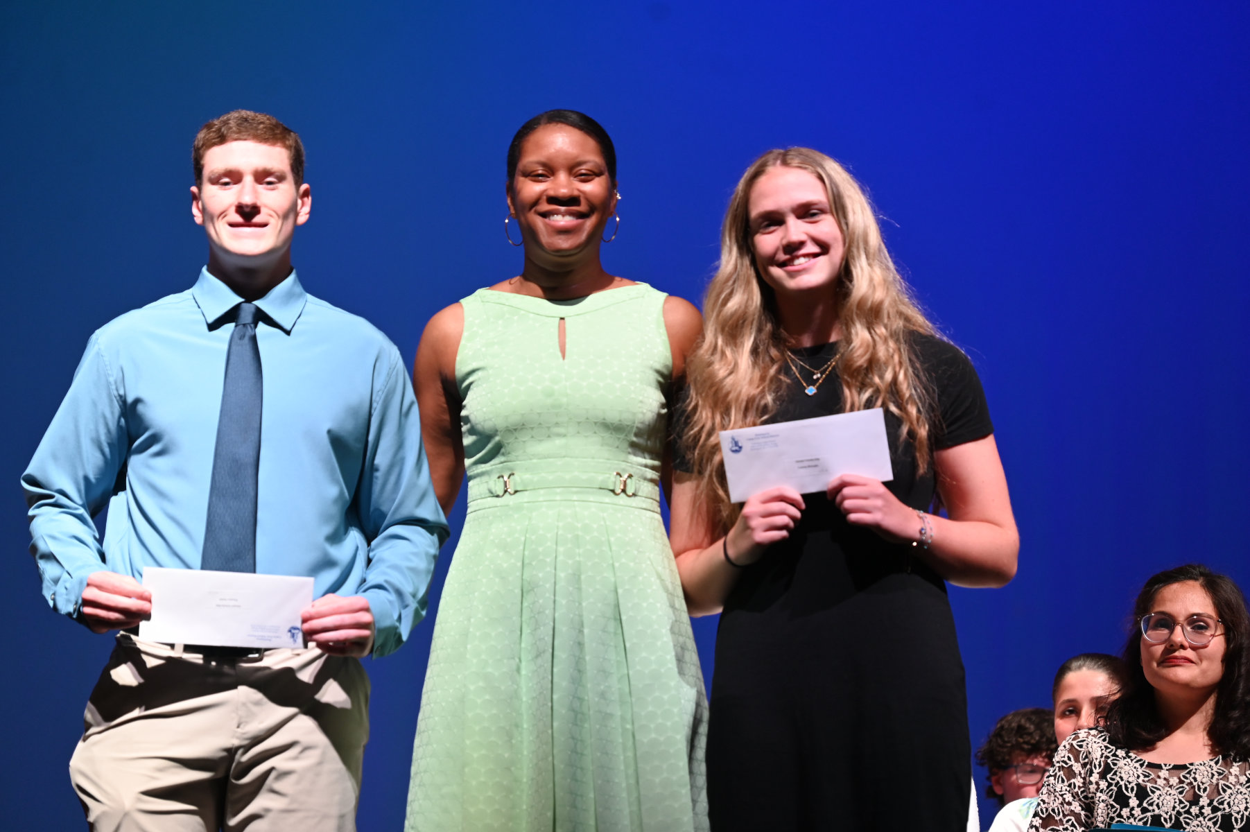  Principal Rochelle C. Brown with Alumni Scholarship recipients Tom Smith and Lauren Donaghy   