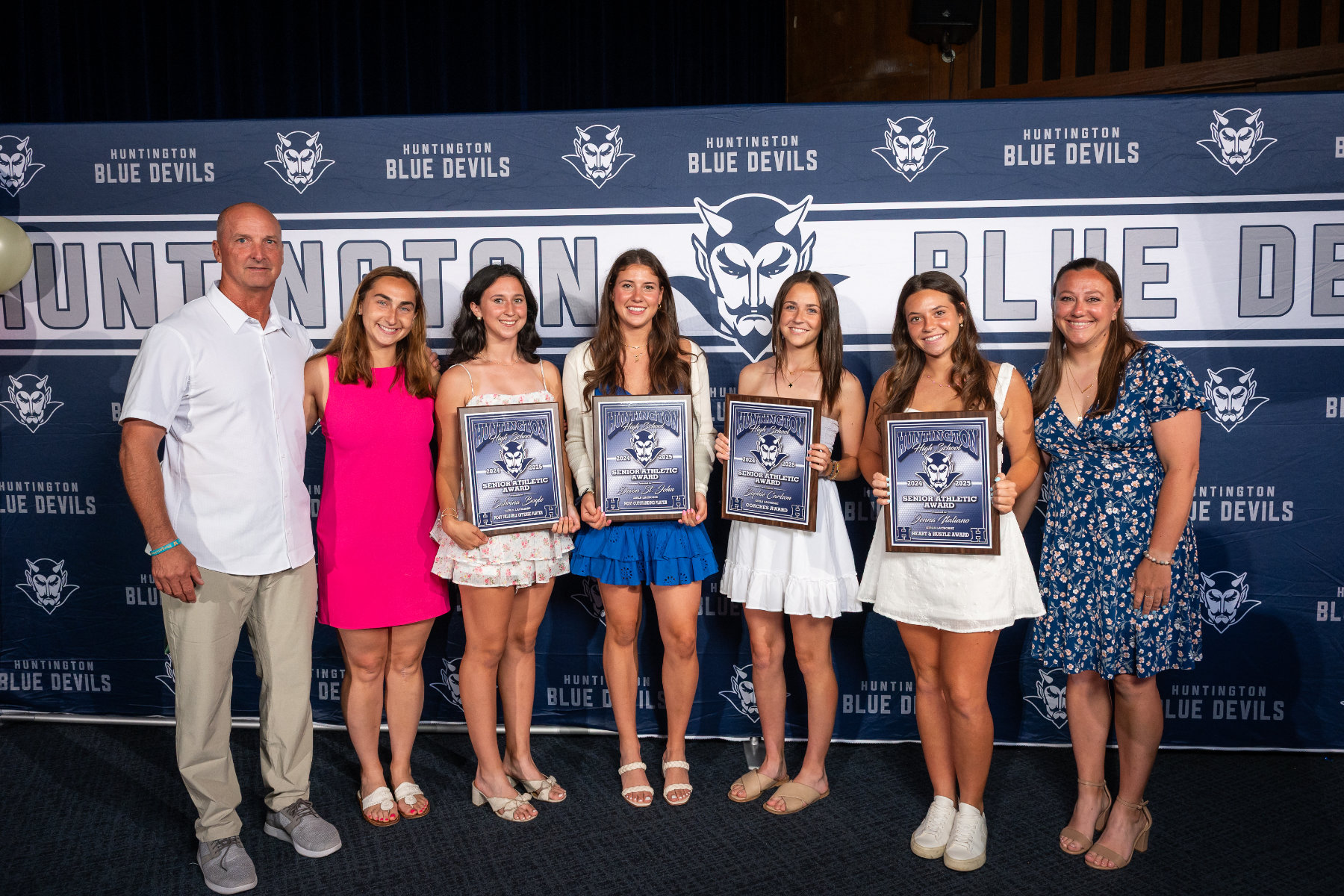  Huntington girls lacrosse team seniors with their coaches at the awards ceremony. (Darin Reed photo.)  