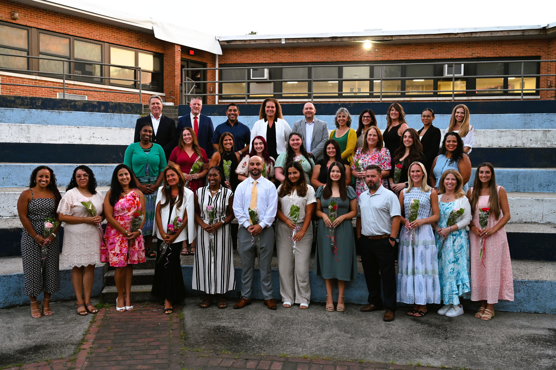  Huntington's administrator and school board with the 20 newly tenured faculty members   