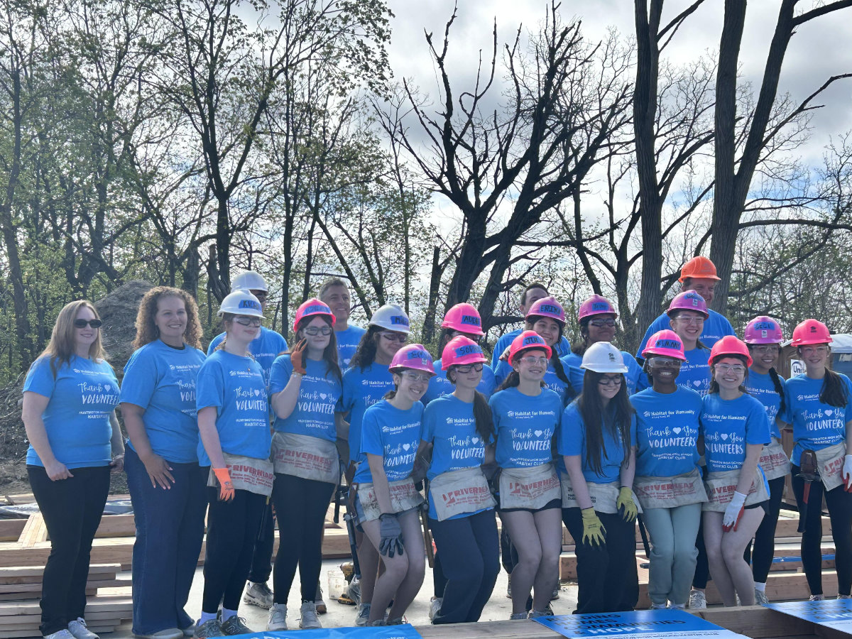  Huntington Superintendent Beth McCoy with Huntington Habitat members on the build site in Wyandanch.   