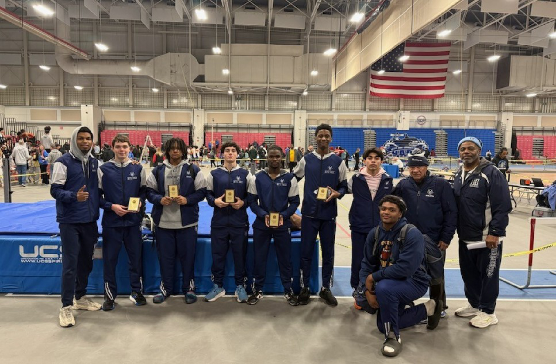  Huntington coaches with their award winning athletes at the state qualifier.   