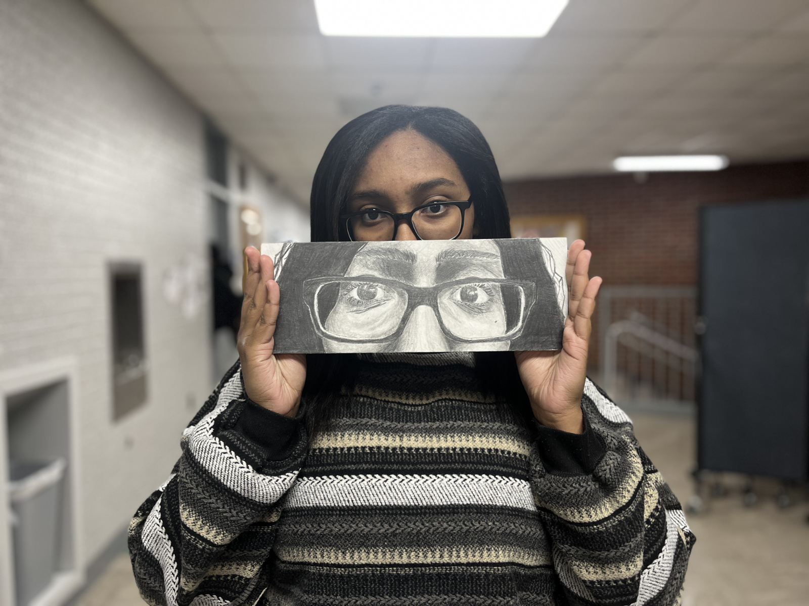  Junior Mya Williams with her artwork.  