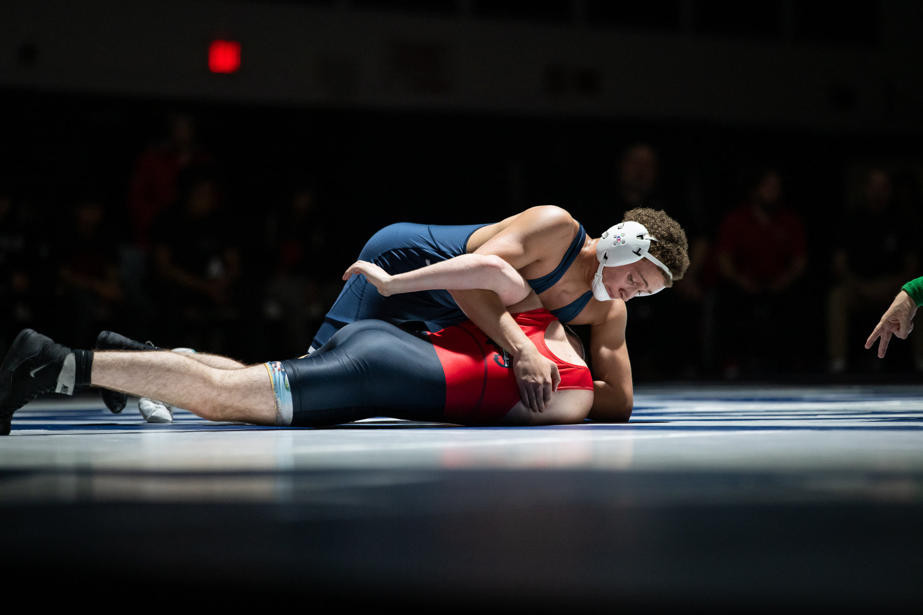Kingsley Evan sinks a bar arm against Newfield. (Darin Reed photo.)'