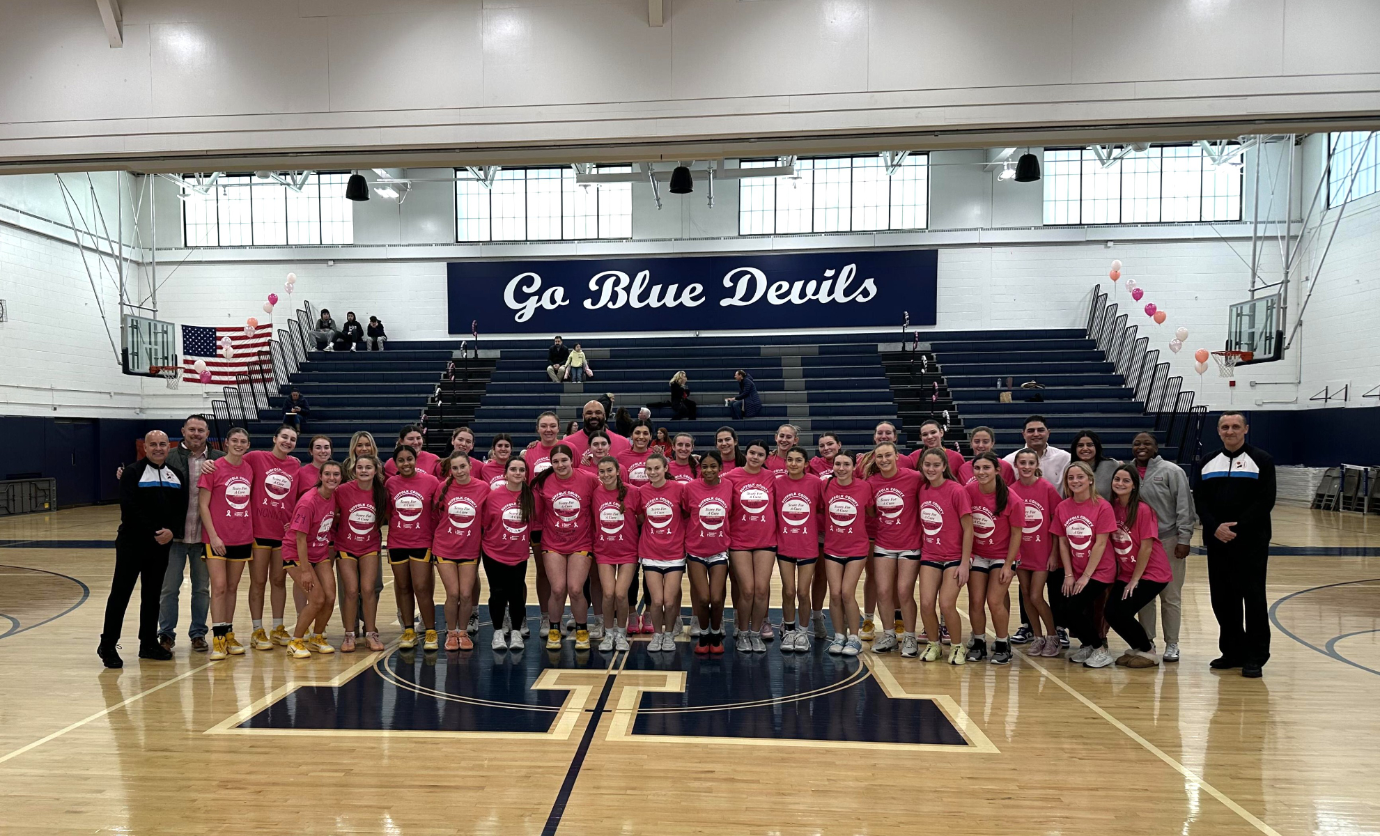  A pre-game photo of the two teams in their special game shirts with coaches and refs. 