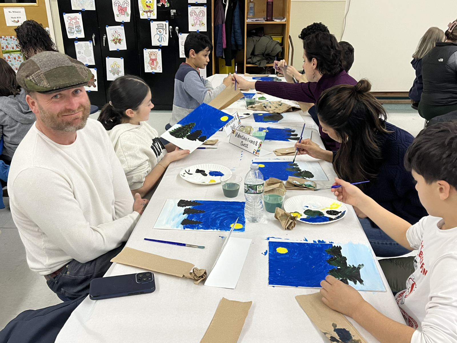 Robert Evans with his wife and children at Family Paint Night at Woodhull
