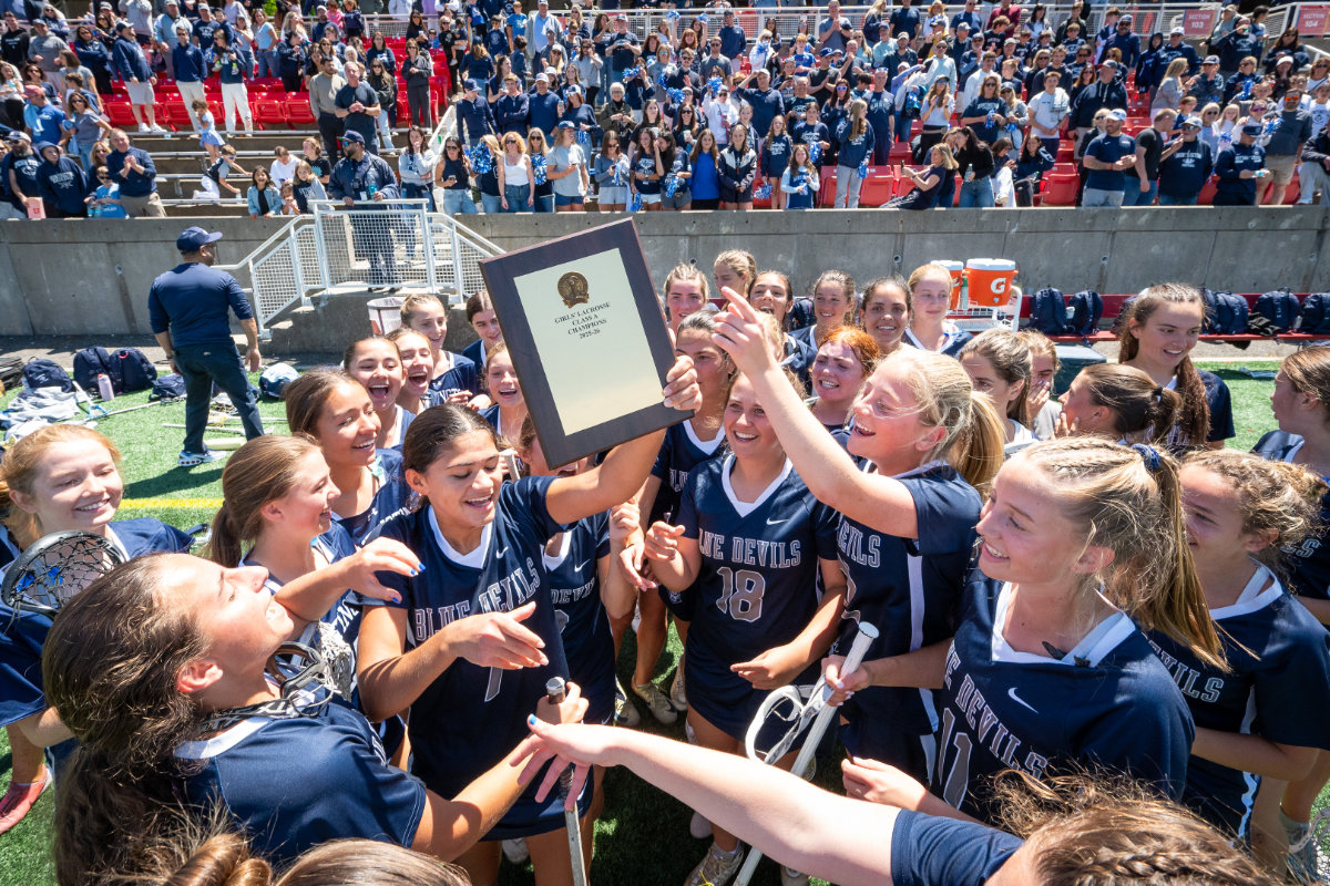  Valentina Puccio holds up the championship plaque after answering the call to battle. (Darin Reed photo.)  