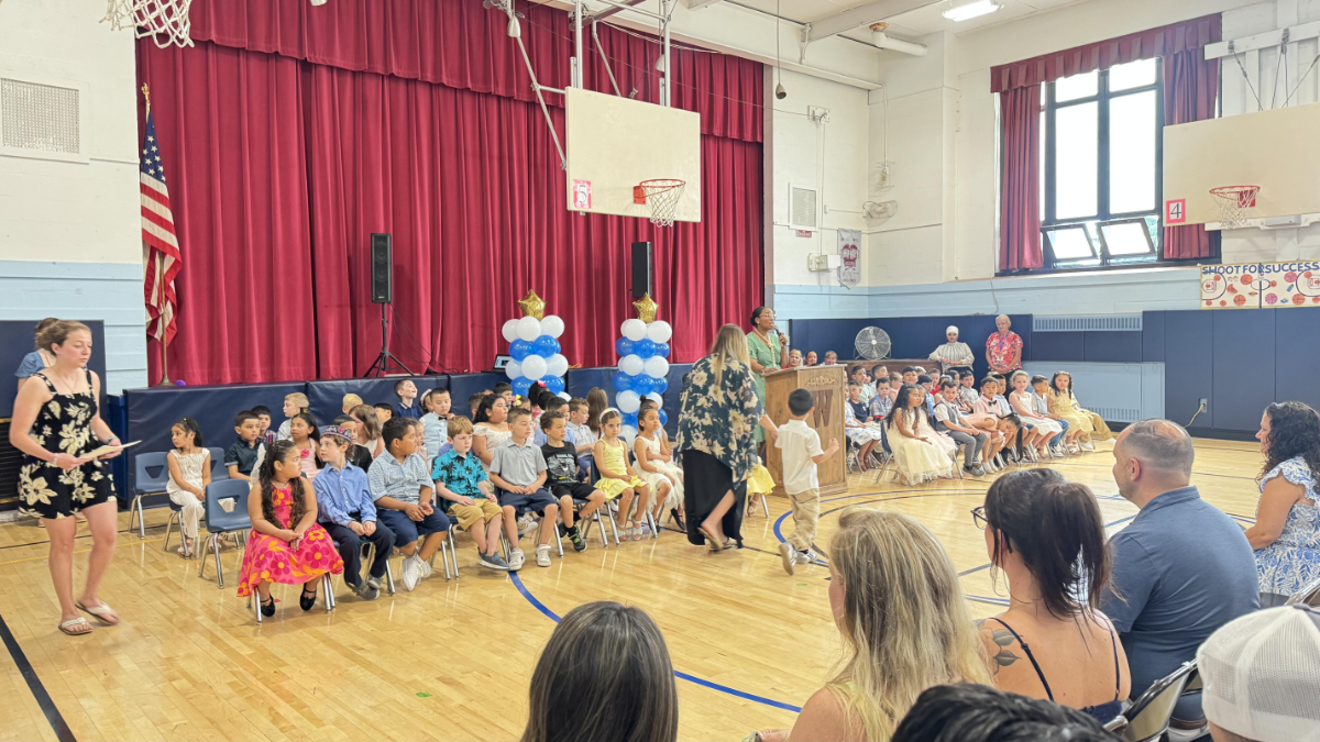 The Washington gym was packed for the kindergarteners ceremony and show.  