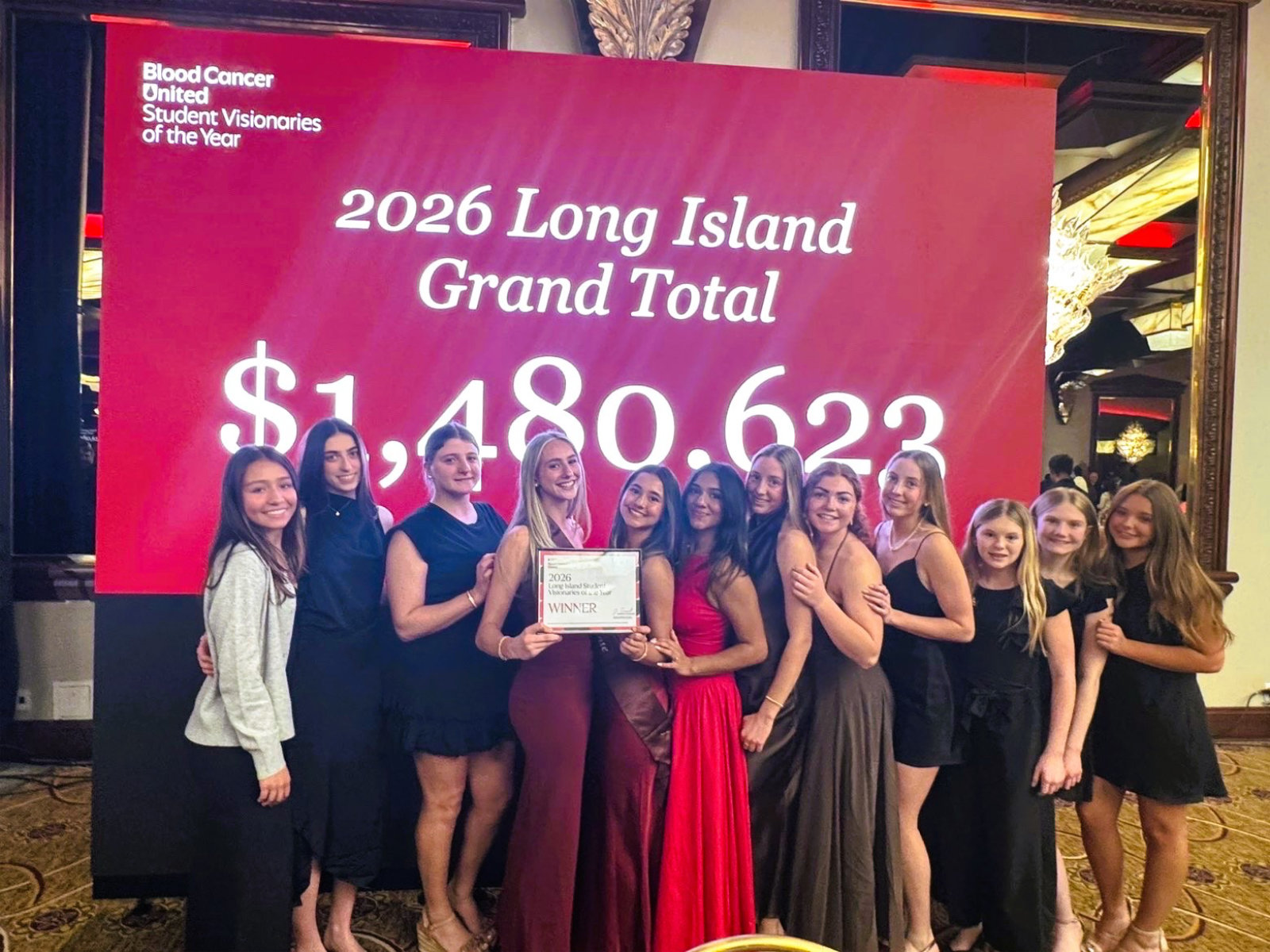  Ava Bencivenga and Violet Palacios with team members at the awards ceremony.  