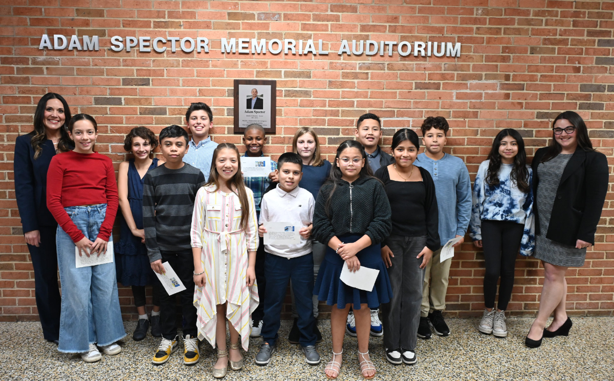  Nicole Leggio (right) with Stephanie Campbell and a group of Woodhull students outside a Huntington School Board meeeting.  